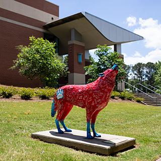 Red wolf statue on-campus.